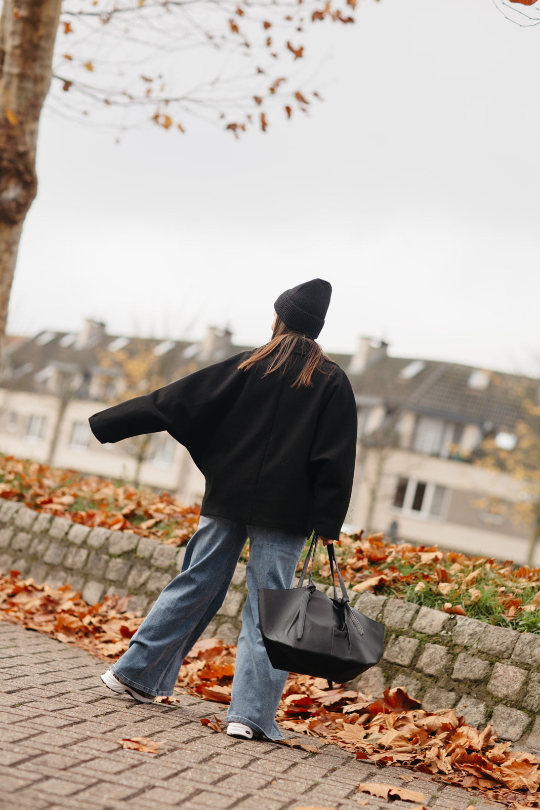 Kort model jas met elegante afwerking