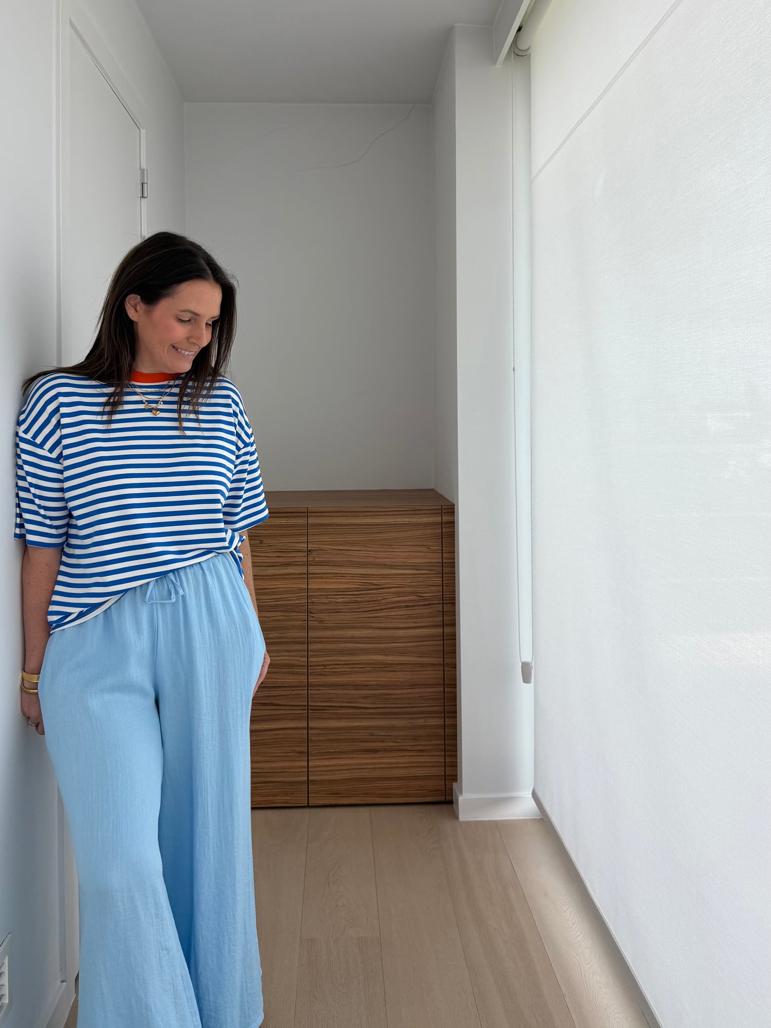 Comfortabele oversized top met blauwe strepen en speelse kleuraccenten