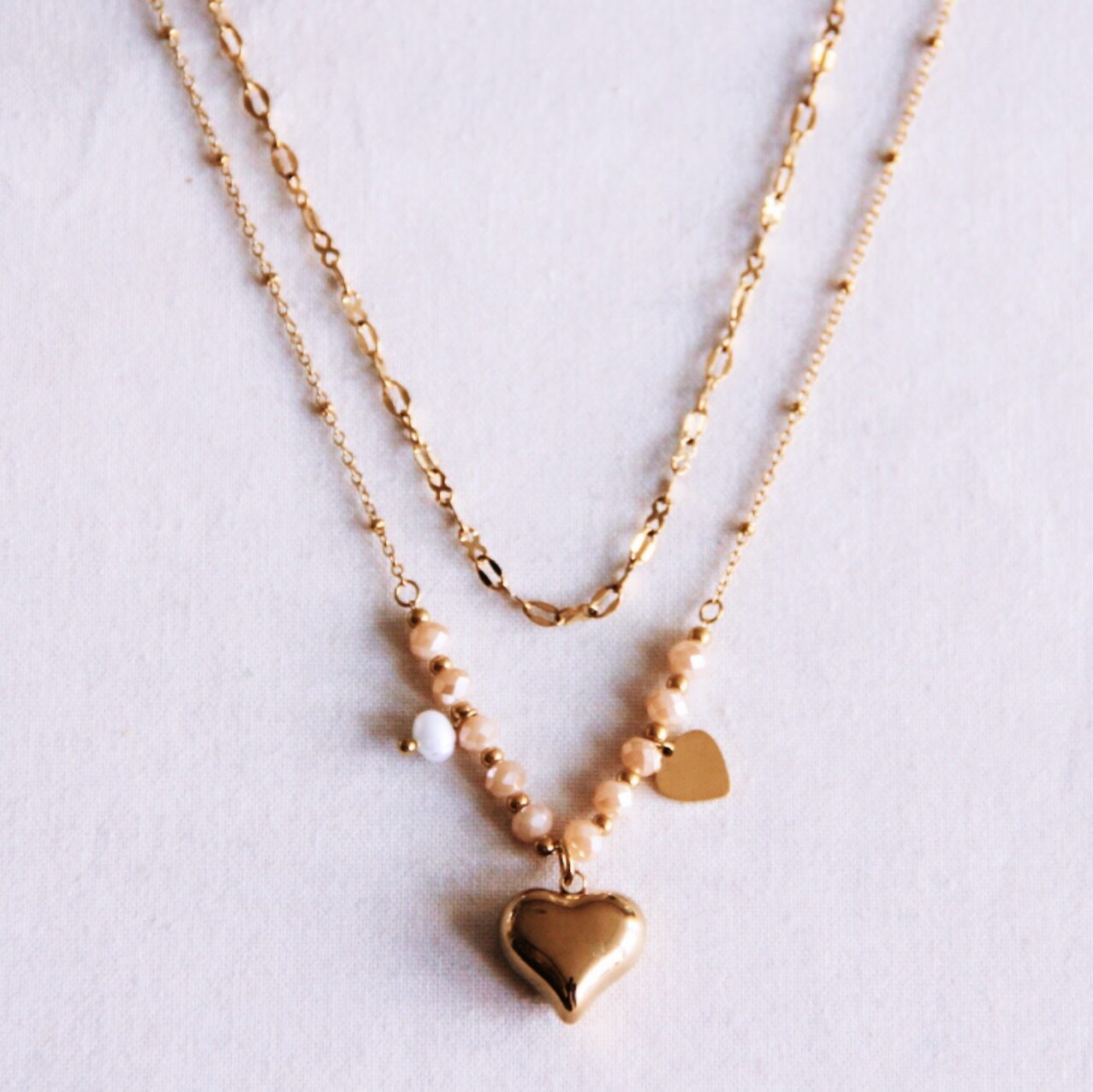 Dubbel ketting van facetten met hartjes en pareltjes beige - My Dressing