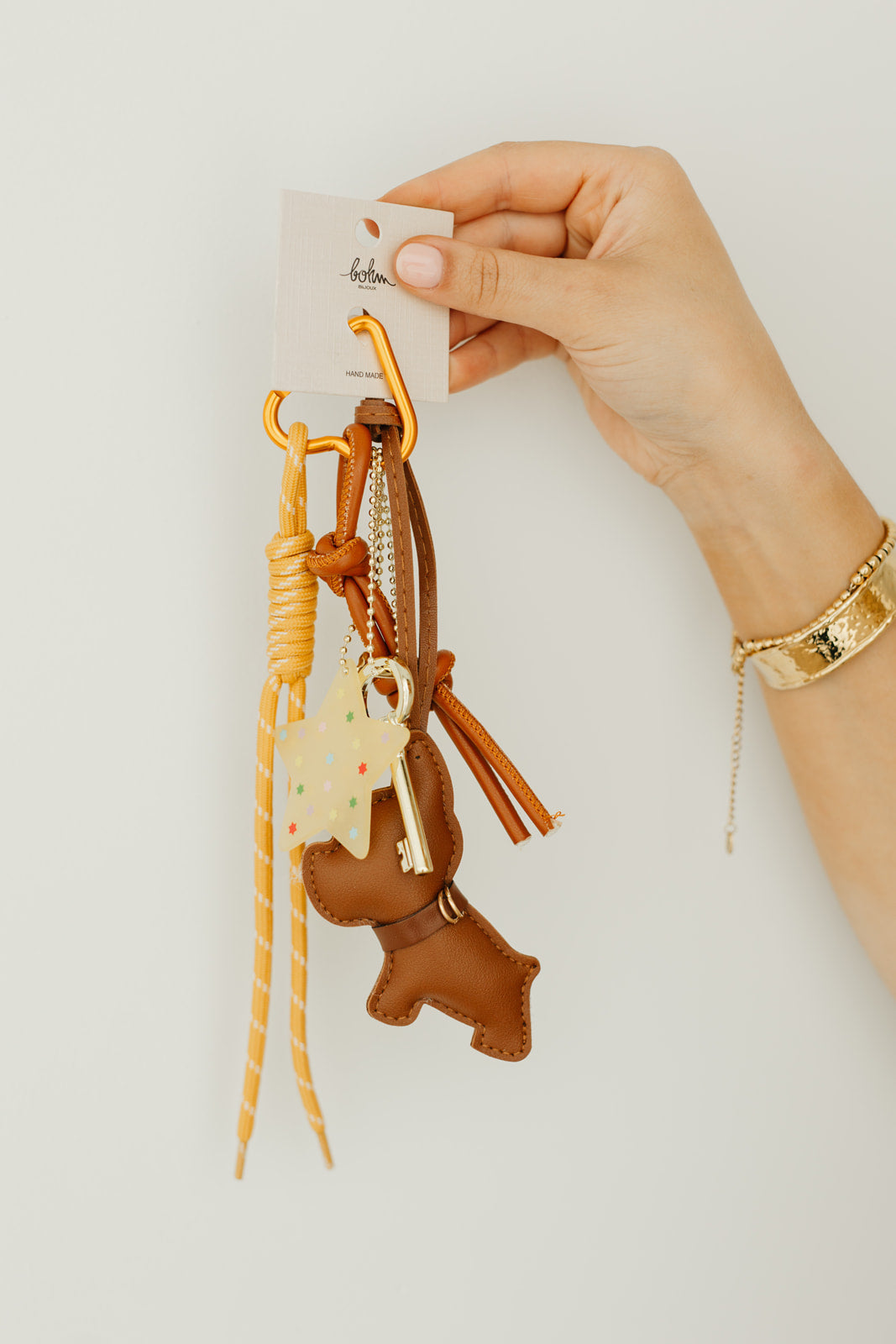 Golden pup bag charm