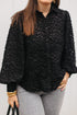Zwarte blouse met pofmouwen en knoopsluiting