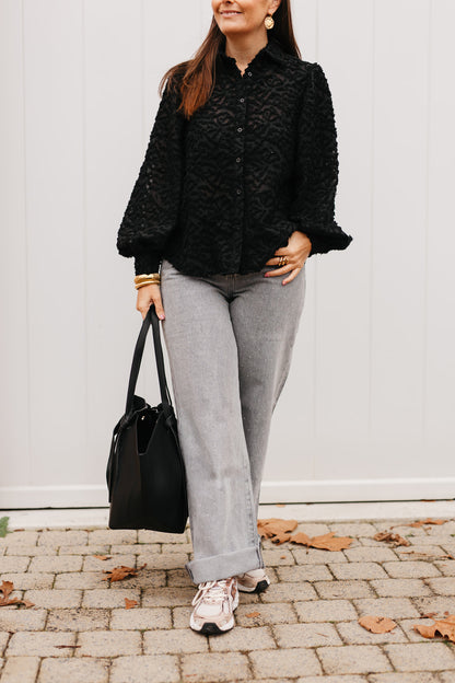 Zwarte blouse met pofmouwen en knoopsluiting